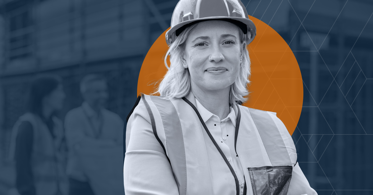 female worker in hard hat smiles at the camera